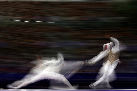 United State's Nick Itkin competes with France's Enzo Lefort in the men's team foil bronze final match